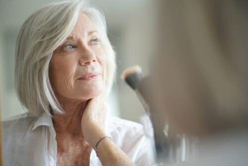 woman looking at window 