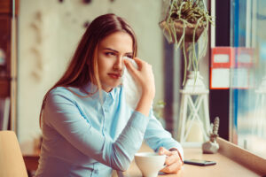 Woman wiping her eyes