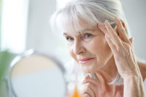 Woman examining wrinkles