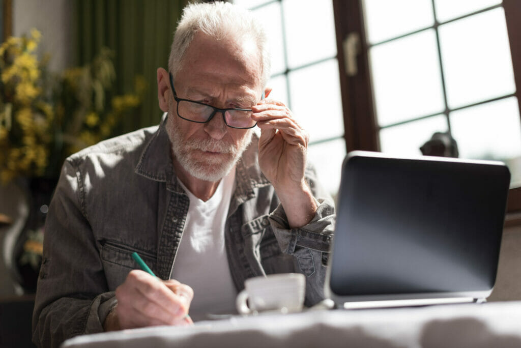 Man with glasses studying